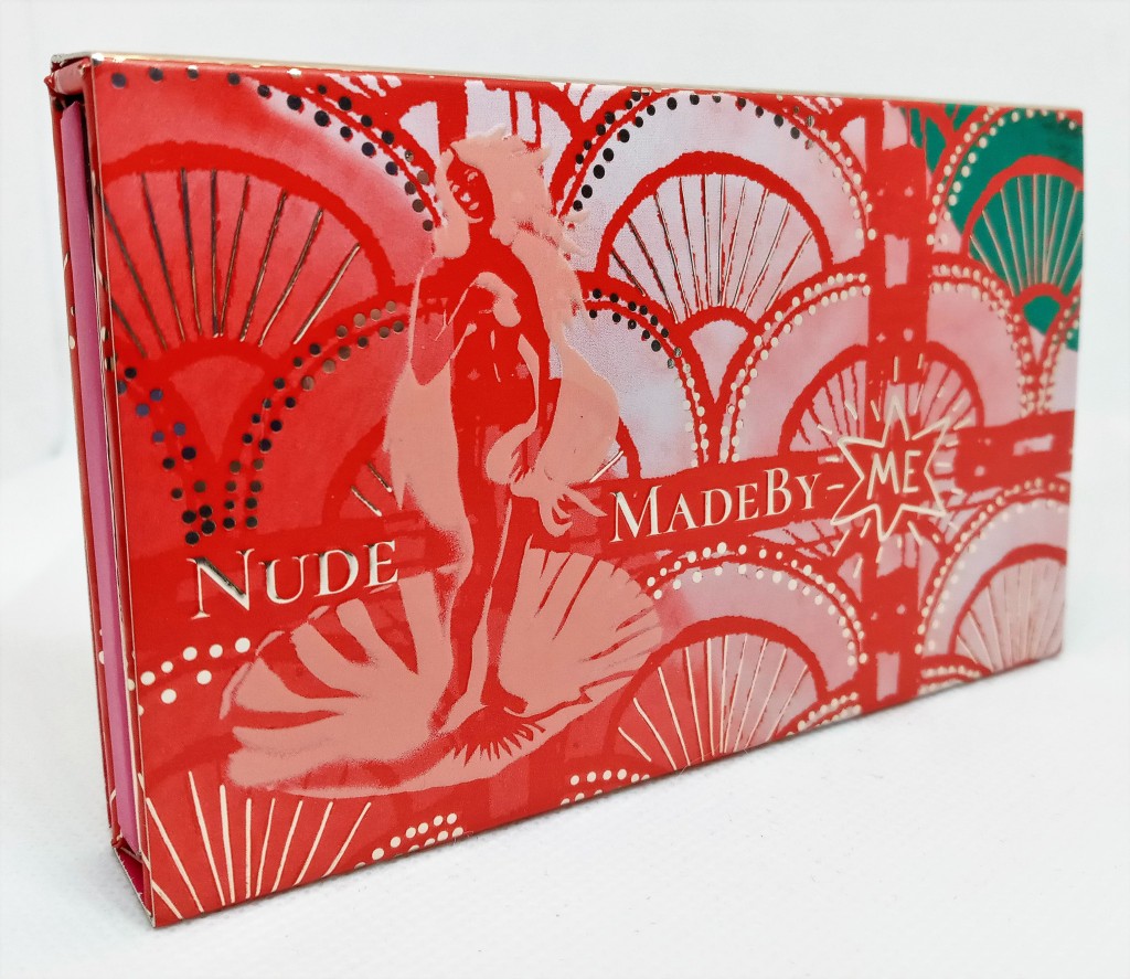 The front of the Palette in its paper sleeve, with a red, pink and green shell pattern, an image of Venus on the half shell and gold dots accenting the images