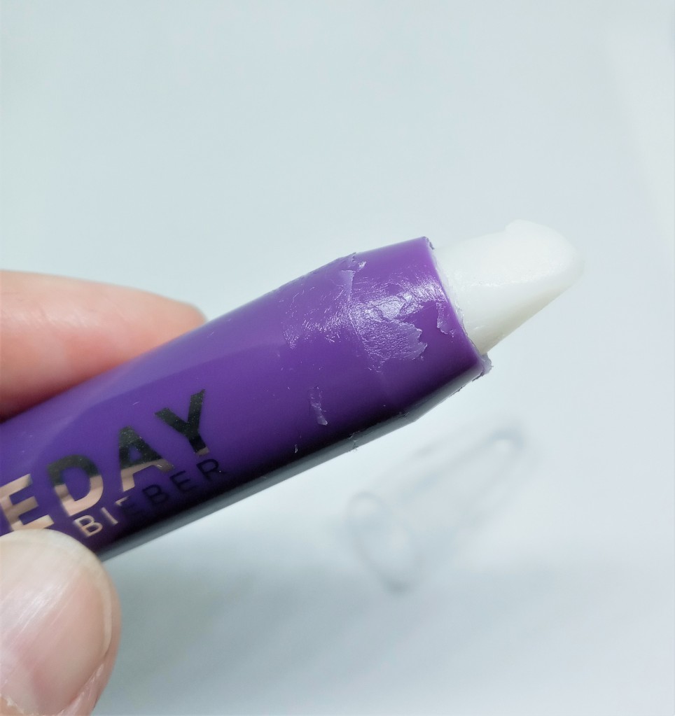 The tip of the Someday perfume pencil, with a bit of perfume smeared on the casing
